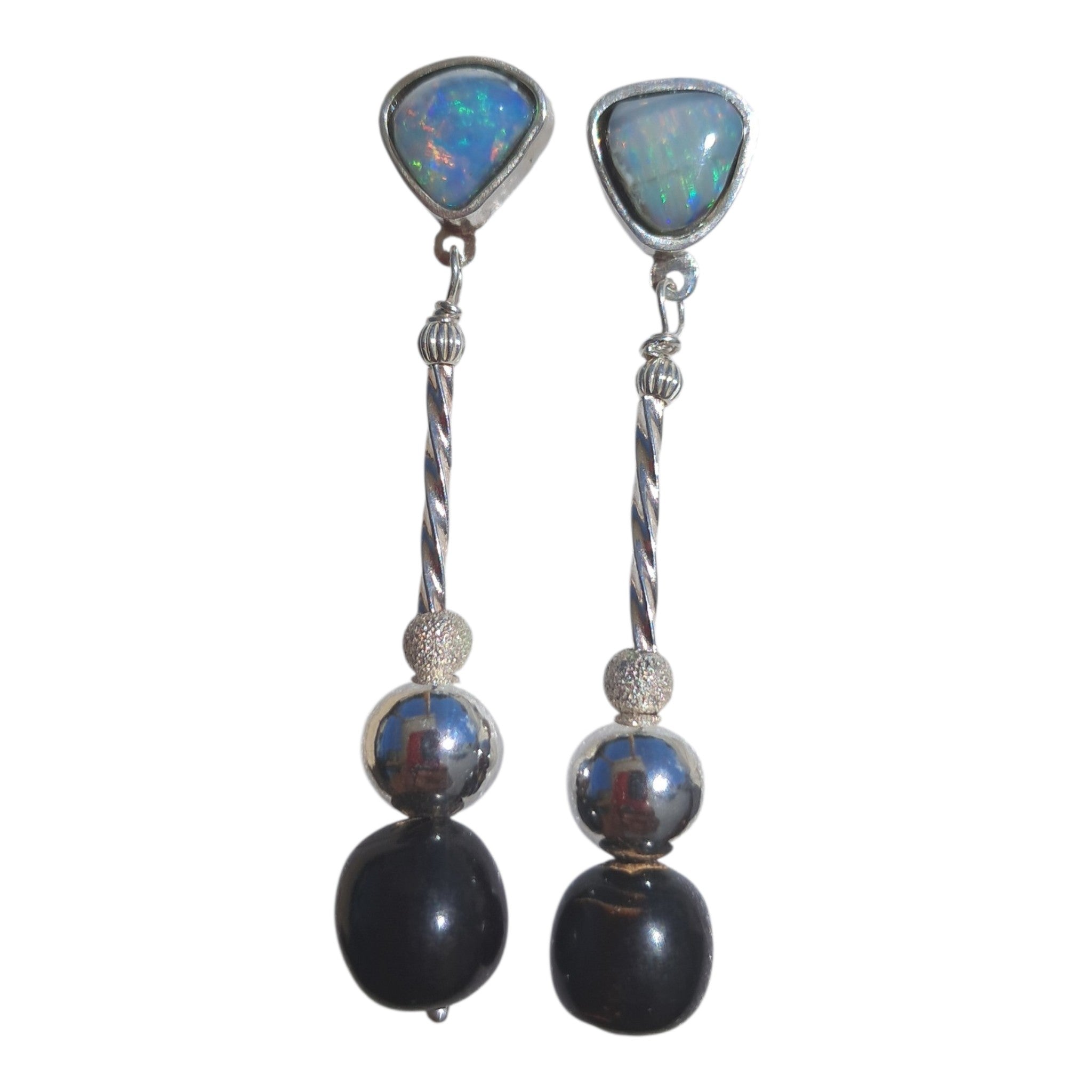 Earrings with genuine black seam opals