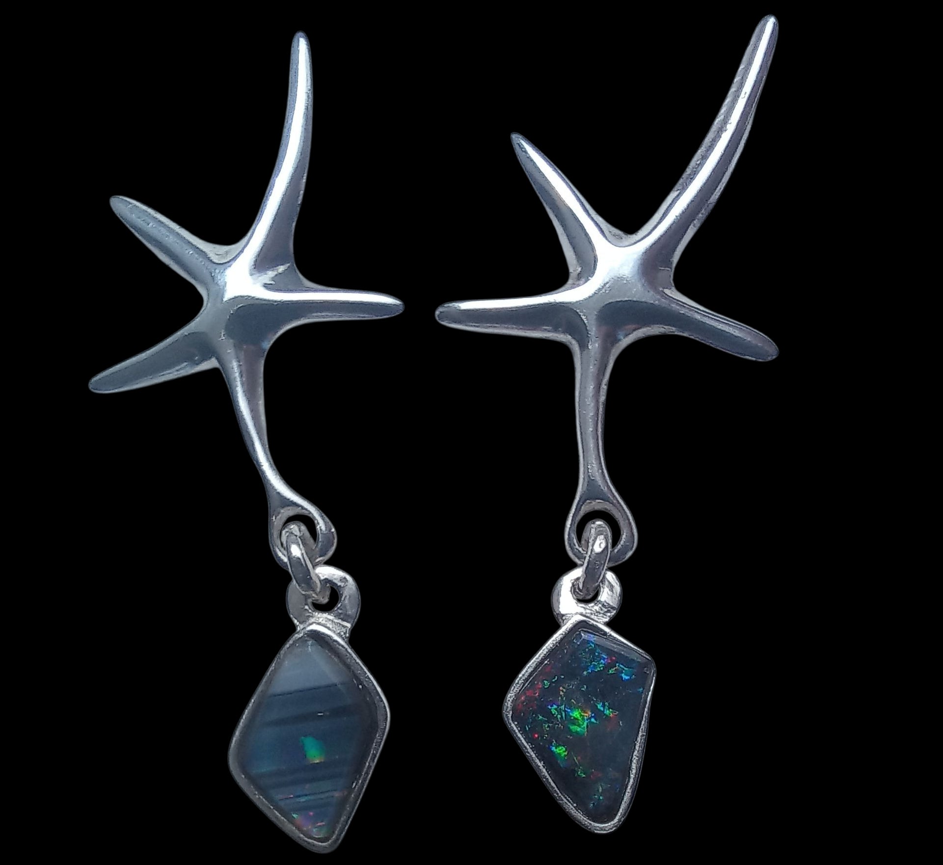 Earrings with genuine black seam opals
