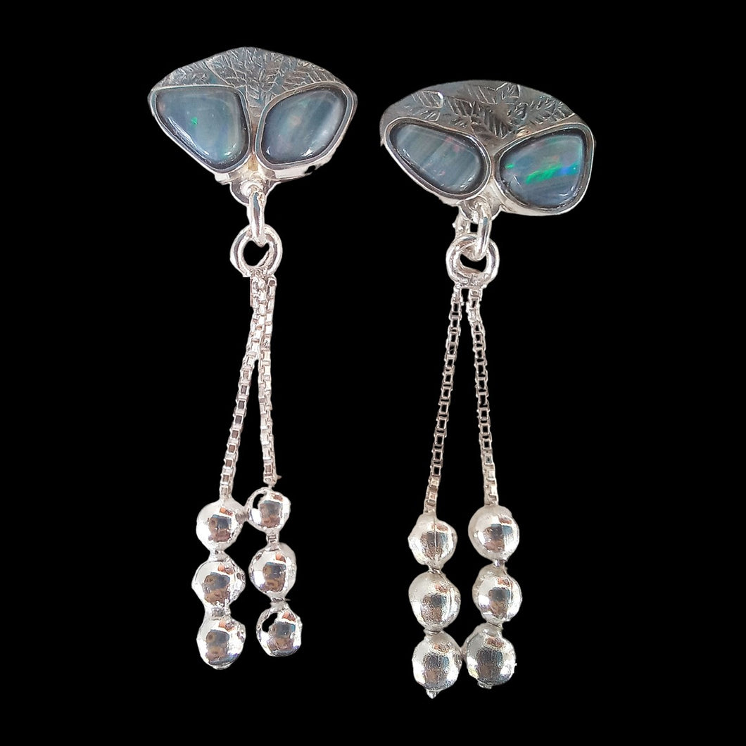 Earrings with black seam opals