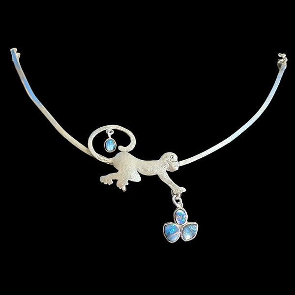 Playful monkey pendant with genuine black opals